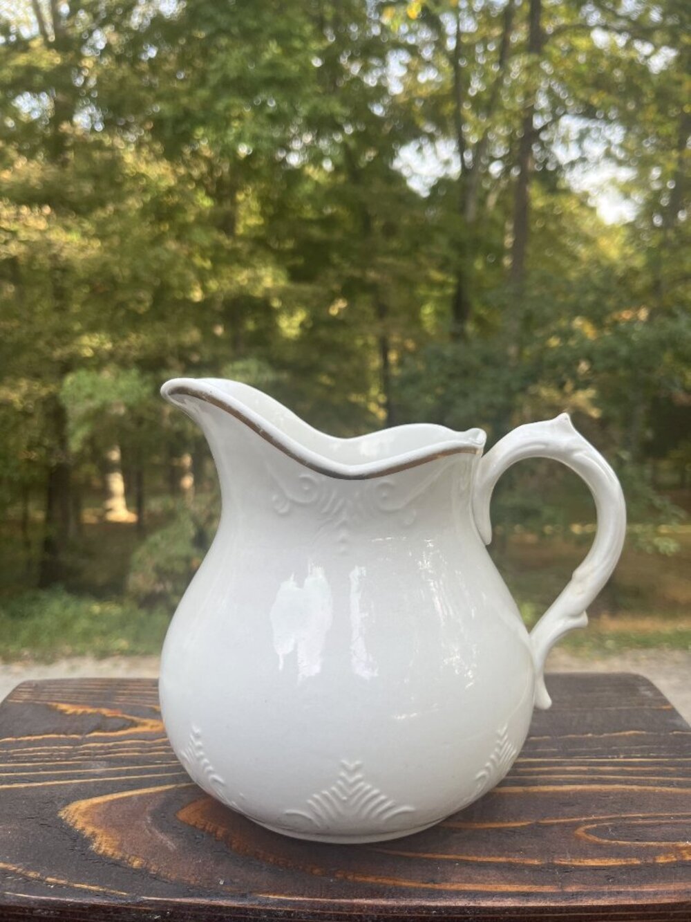 Antique White Ceramic Pitcher With Gold Trim And Embossed Detailing - 6 Inches T